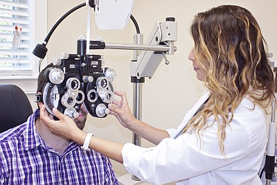 Dr. Miki Lyn D'Angelo performing an eye exam